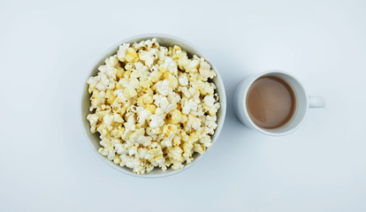 Cocoa and popcorn on a white background.