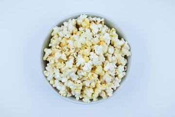 Flat lay of pop corn bowl on a white background,Top view.
