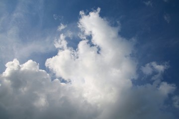 Naklejka na ściany i meble Fluffy Billowy Cumulus Clouds in the Blue Summer Sky in Florida