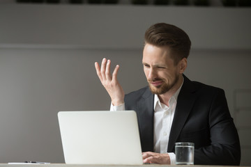 Angry client or confused male CEO showing misunderstanding and annoyance reading financial failing...