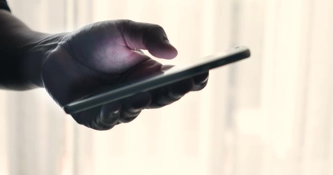 Close up hand using smartphone touching a display screen , 4K Dci resolution