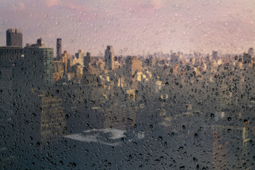 View on Manhattan midtown through the window with rain drops. New York City