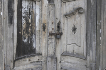 The locked door leading into the old church morgue. Door is very decorative but not maintained for...