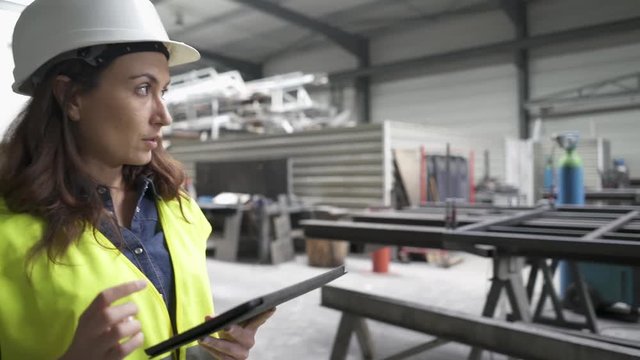 Metal industry engineer controlling stock in factory