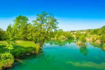      Beautiful village of Belavici on the bank of Mreznica river, countryside landscape, Croatia 