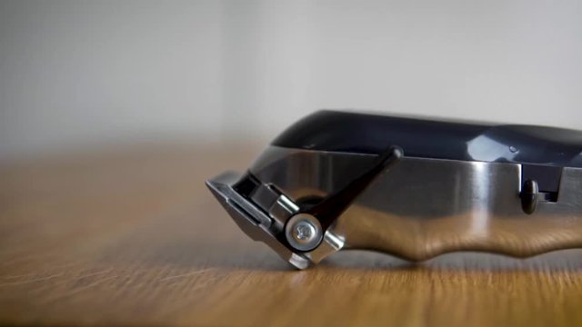 Barbering hair clipper on a table.