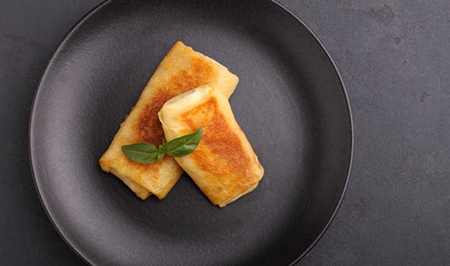 Close up of rolled pancakes with meet