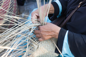 Naklejka premium The villagers took bamboo stripes to weave into different forms for daily use utensils of the community’s people in Bangkok Thailand, Thai handmade product. 