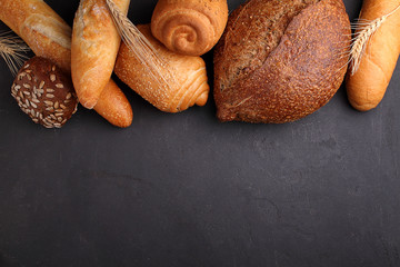 Pile of fancy bread on black stone background