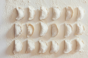 Dumplings on the table with flour, layout for recipe