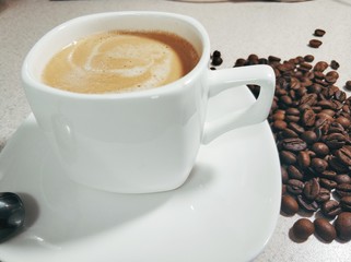 a cup of coffee on a saucer