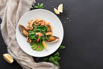 Warm salad with grilled seafood flat lay