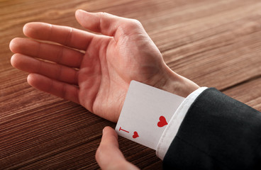 Business man with ace in his sleeve.