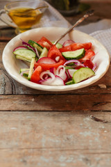 Vegetable salad from organic vegetables - healthy food (fresh vegetable set).  Food background