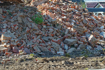 Heap of rubble after demolition of an old residential house
