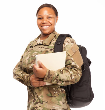 Happy female soldier in multicam uniform and going to college.