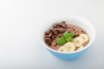 Chocolate pudding, banana and herbs in