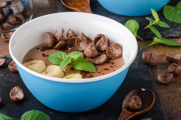 Chocolate pudding, banana and herbs in