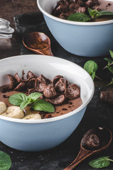 Chocolate pudding, banana and herbs in