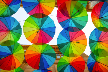 Rainbow umbrellas roof street in Victory Passage , Bucharest, Romania