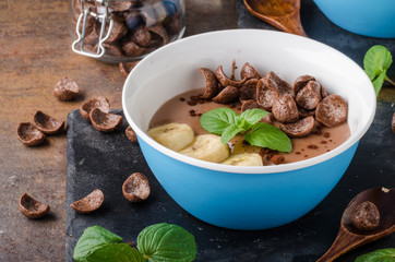 Chocolate pudding, banana and herbs in