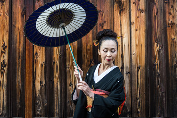 Asian woman with yukata walking in Kyoto, Japan
