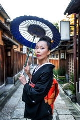 Asian woman with yukata walking in Kyoto, Japan