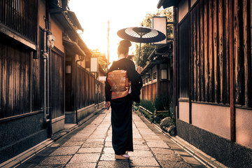Asian woman with yukata walking in Kyoto, Japan