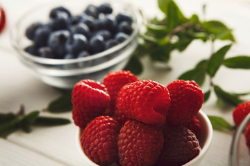 Mixed berries in glass bowls closeup