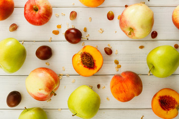 Naklejka na ściany i meble Autumn harvest background with apples and peaches