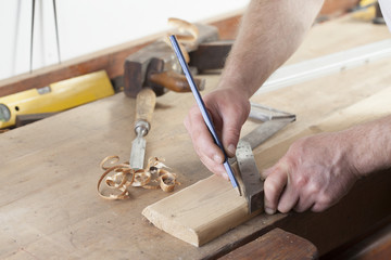 Fototapeta na wymiar carpenter drawing on a wooden board.copy space