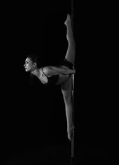Young slim sexy pole dance woman