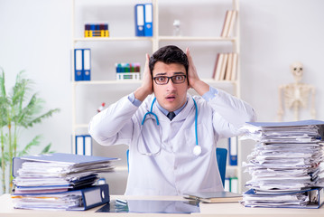 Busy doctor with too much work in hospital