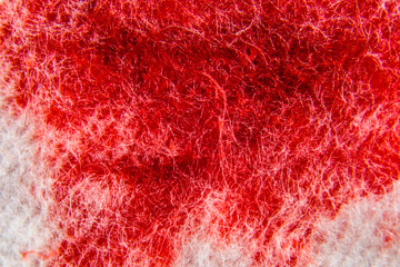Background with blood is on a soft absorbent cotton surface macro