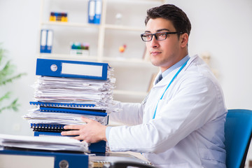 Busy doctor with too much work in hospital