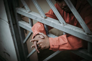 Hands of men desperate to catch the iron prison,prisoner concept,thailand people,Hope to be free,A...