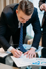 man signing contract closeup. business partnership and cooperation. deal closing and legal...