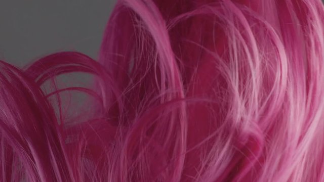Closeup of pink hair creative colored texture slow motion from 60fps. lowed in air hair