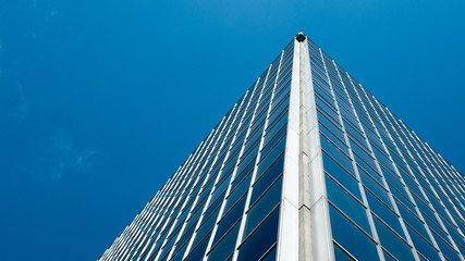 Fototapeta na wymiar Angle view of modern building with a clear blue sky in background