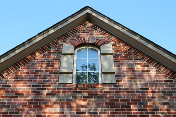 Brick house with window and shutters 