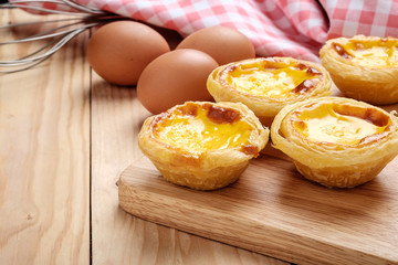 Egg tart on wooden plate