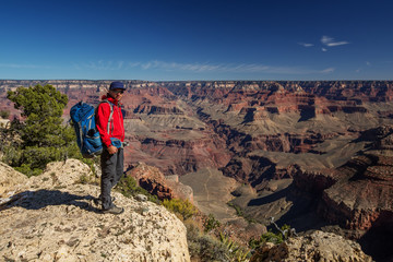 Fototapeta premium A hiker in the Grand Canyon National Park, South Rim, Arizona, USA