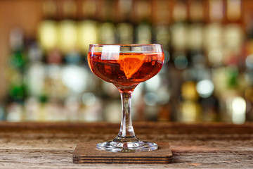 Red cocktail on the bar