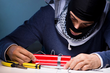 Terrorist bomber preparing dynamite bomb