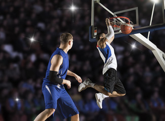 Fototapeta premium Two basketball players in action