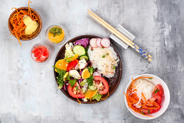 Spicy glass noodles with vegetables - carrots, cucumber, peppers, garlic.