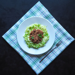 Plate of Zucchini spaghetti with beef bolognese.