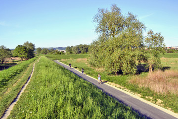 Healthy lifestyle - people riding bicycles on a sunny spring day