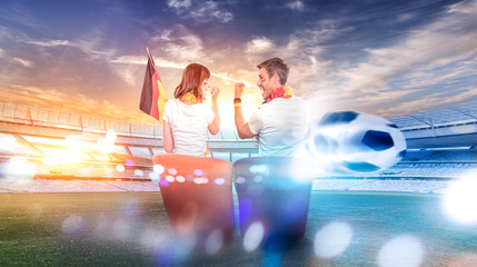 german couple watching live soccer cup