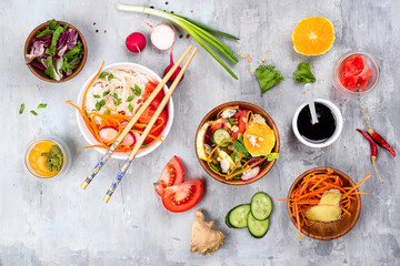 bean thread noodles salad with cucumber and carrot, vegetarian salad on a plate on stone background